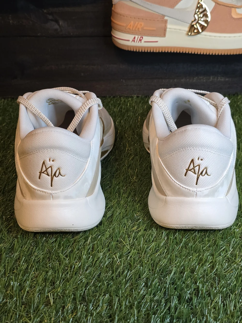 Nike Women's White Sneakers with Gold Swoosh